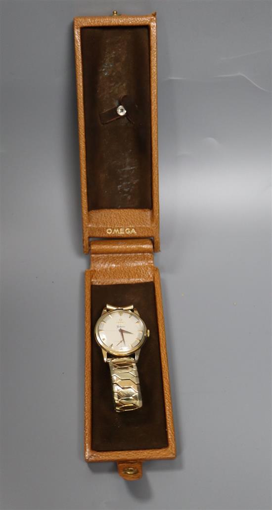 A gentlemans late 1950s 9ct gold Omega manual wind wrist watch, movement c.267, on associated rolled gold bracelet,